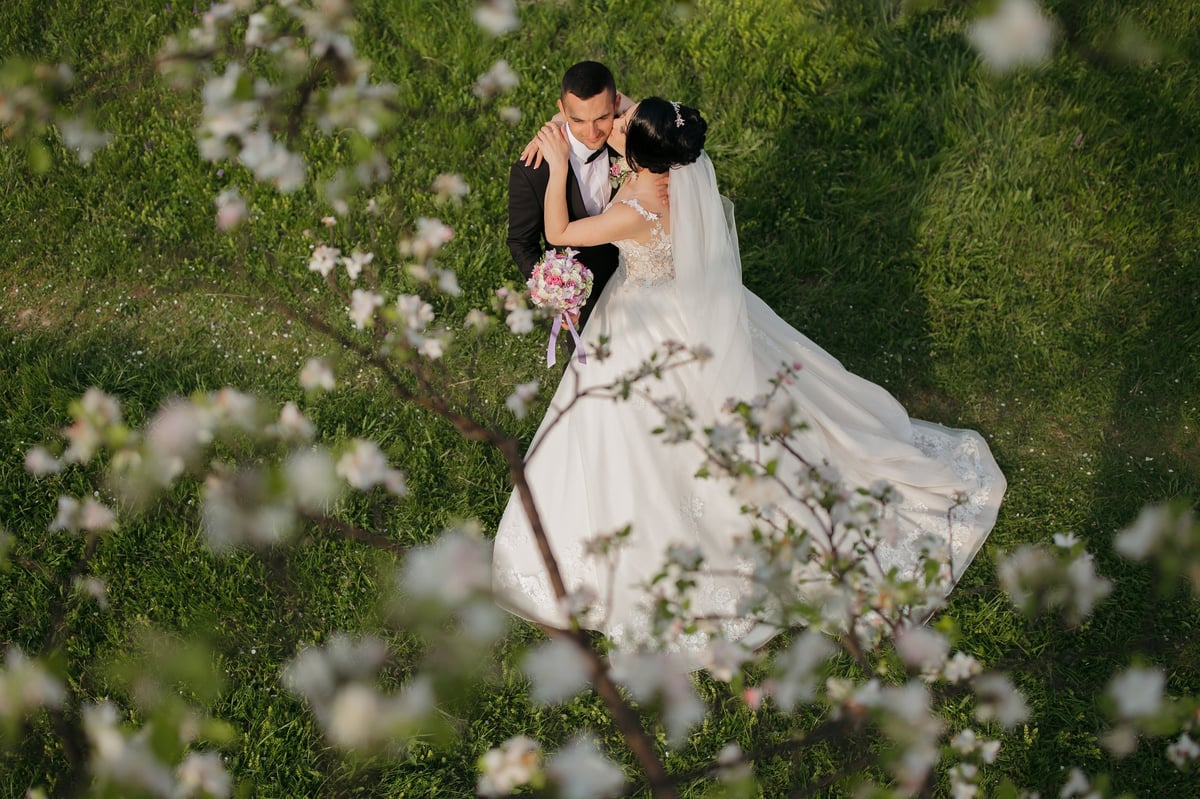 Couple being photographed in an outdoor natural setting